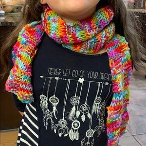 small and large bundle of homemade scarves